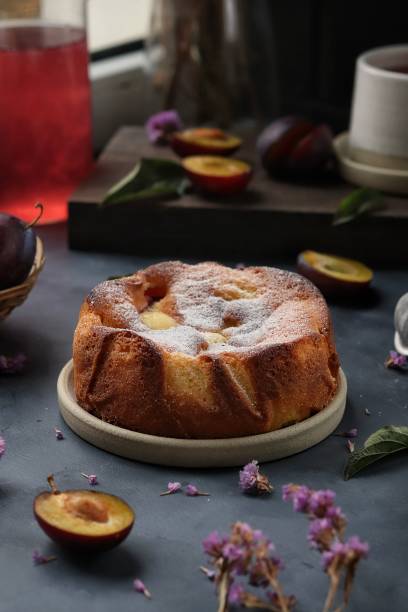 istock Homemade pie with plums on the dark background. 1528419338
