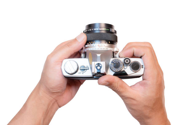 istock Man holding old film camera, white background and isolate. 1528429893