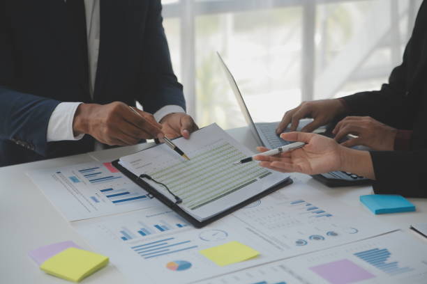 istock Close up of Business team analyzing income charts and graphs with modern laptop computer. Business analysis and strategy concept. 1528441981