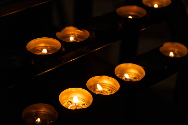 Burning candles in a Catholic Christian church.