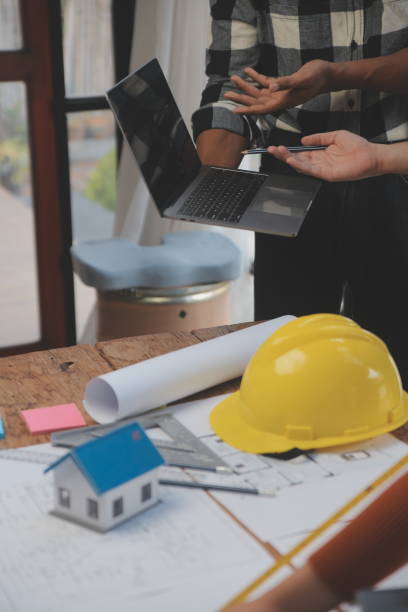 istock Engineer Teamwork Meeting, Drawing working on blueprint meeting for project working with partner on model building and engineering tools in working site, Construction and structure concept. 1528476166