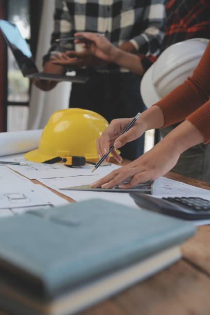 istock Engineer Teamwork Meeting, Drawing working on blueprint meeting for project working with partner on model building and engineering tools in working site, Construction and structure concept. 1528478796