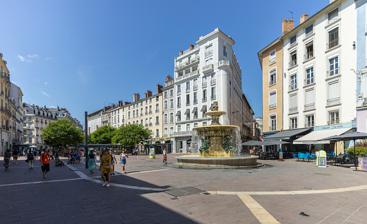 Grenoble, France - July 8, 2023: Place Grenette. The fountain, \