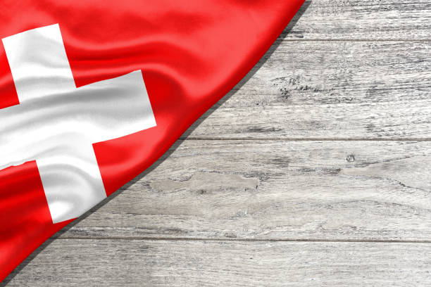 flag of Switzerland on wooden planks. Bundesfeiertag. stock photo