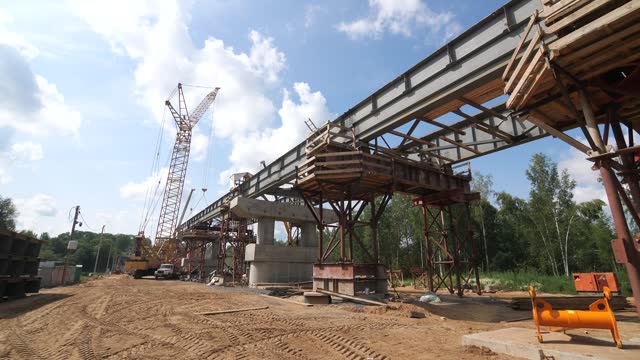 construction site of a modern reinforced concrete bridge across the river
