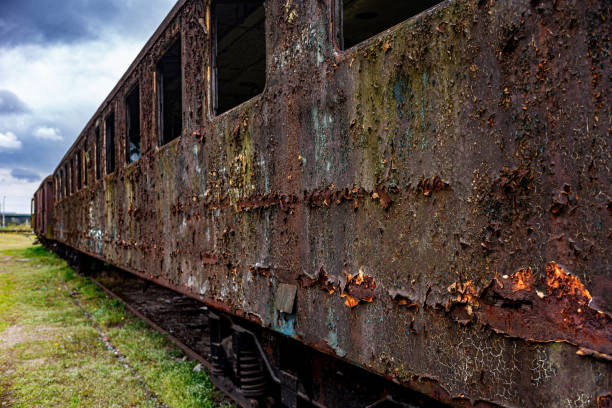 istock Old rusty passenger car abandoned on railway tracks 1528667533