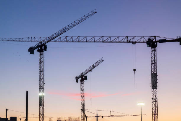 istock cranes on the construction site, dusk on the construction site 1528674687