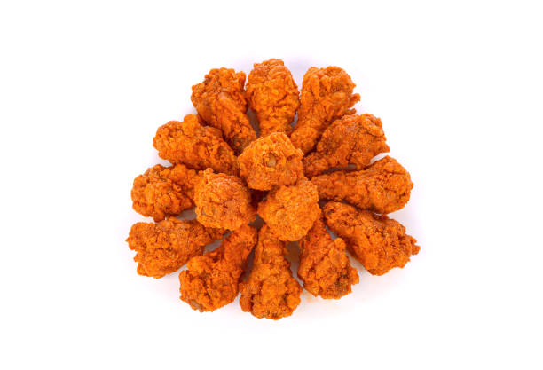 istock Heap of fried spicy chicken isolated on white 1528684012