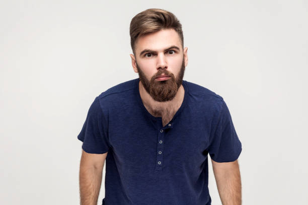 istock Disgruntled man looking with annoyed indignant expression at camera, being angry and aggressive. 1528724731