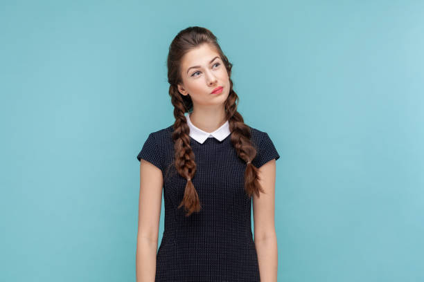 istock Pensive thoughtful woman standing and looking away, making decision, thinks about solving problem. 1528727843
