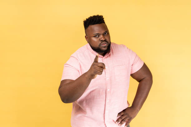 istock Man pointing finger at camera looking with dissatisfied suspicious expression warning about troubles 1528745777