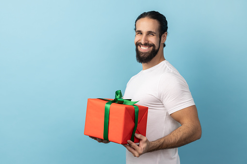 Man Raging Out Gift Man Holding Out Red Wrapped Gift Box With Green Ribbon Giving Present ...