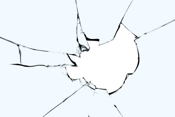 istock Hole and cracks on broken glass. A broken window. 1528776234