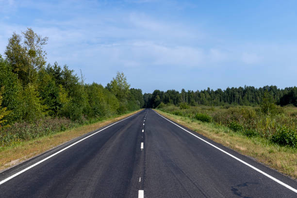 istock Narrow paved road for cars 1528786218