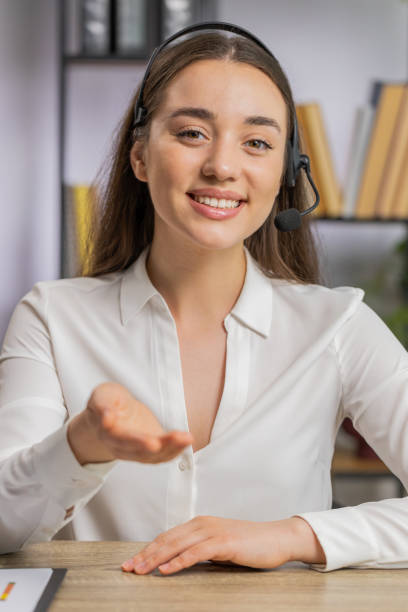 istock Businesswoman working on laptop wearing headset call center support service operator office helpline 1528902678