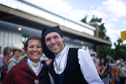 Santa Fe, NM: Smiling Italian artists in traditional dress at the Folk Art procession at the Santa Fe Railyard plaza. The procession kicks off the annual International Folk Art Market (IFAM), where folk artists from over 50 countries and tribes participate.