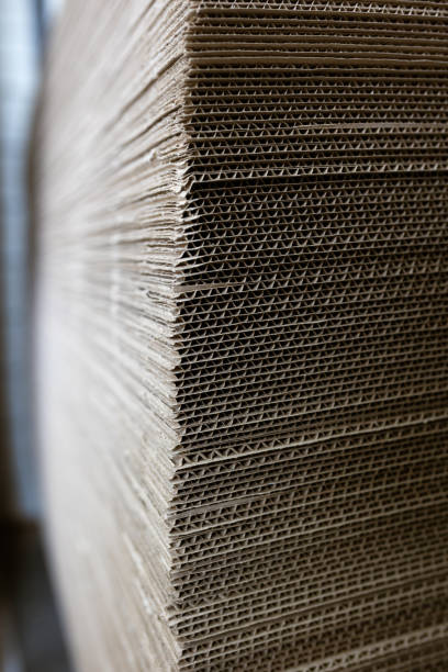 istock A cardboard sheets in stack. Perforated sheets of corrugated cardboard are stacked on pallets. Packaging of finished products in industrial production. 1529000355