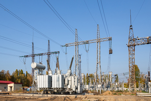 The outdoor extra high voltage power transformer. A high-voltage power electrical substation.