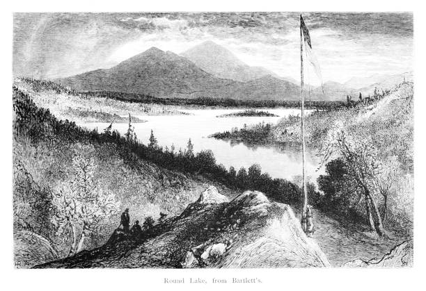 Round Lake in the Adirondack Mountains, New York State, United States, American Geography Round Lake as seen from Bartlett in the Adirondack Mountains, New York State, USA. Pen and pencil, engraving published 1874. This edition edited by William Cullen Bryant is in my private collection. Copyright is in public domain. adirondack mountains stock illustrations