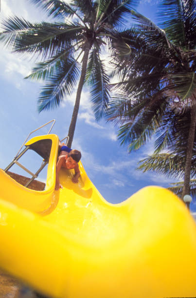 multicolored water slides in amusement aqua park outdoors sunny summer leisure day