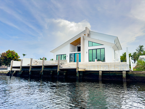 Fort Lauderdale, FL, USA.- July 6, 2023: Kayak or SUP pov of waterfront backyard homes in Fort Lauderdale Florida