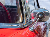 GERMANY - JUL 08, 2023: Rearview Mirror of Chevrolet Bel Air 1956