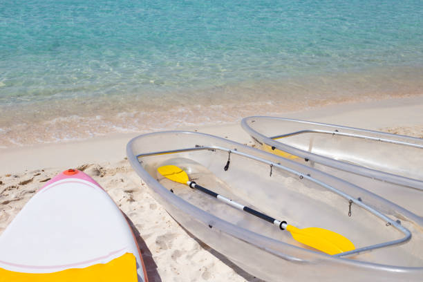 istock Transparent kayak canoe on the beach 1529371155