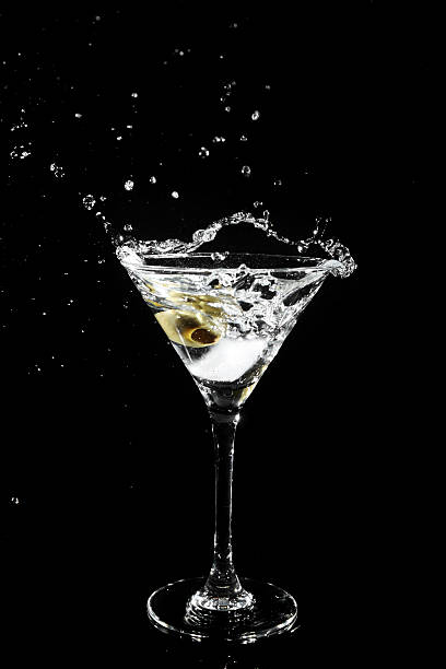 istock Splashing olive into a martini glass 152938282
