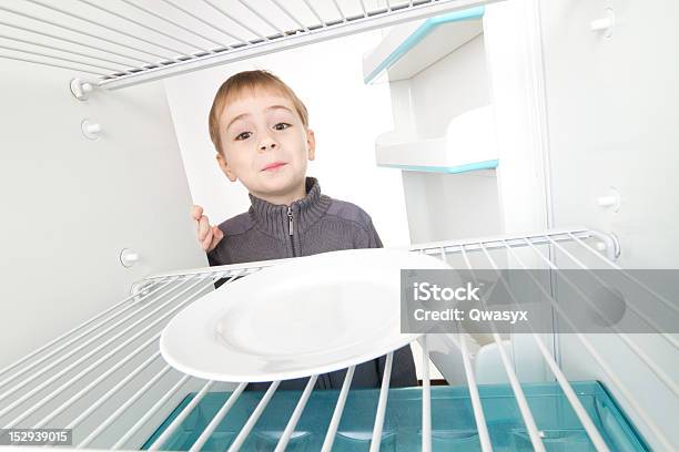 Boy And Empty Refrigerator Stock Photo - Download Image Now - Appliance, Boys, Child