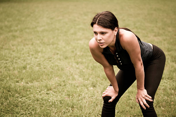 istock Woman catching her breath after jogging 152939160