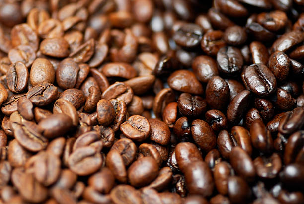 istock Mixture of decaffeinated and caffeinated arabica coffee beans. 152939584