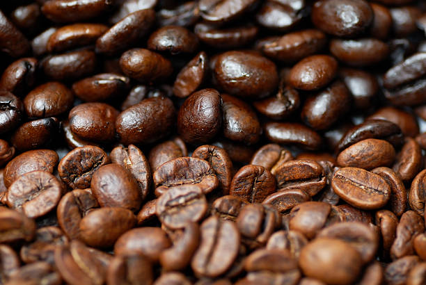 Caffeinated and decaffinated coffee beans. stock photo
