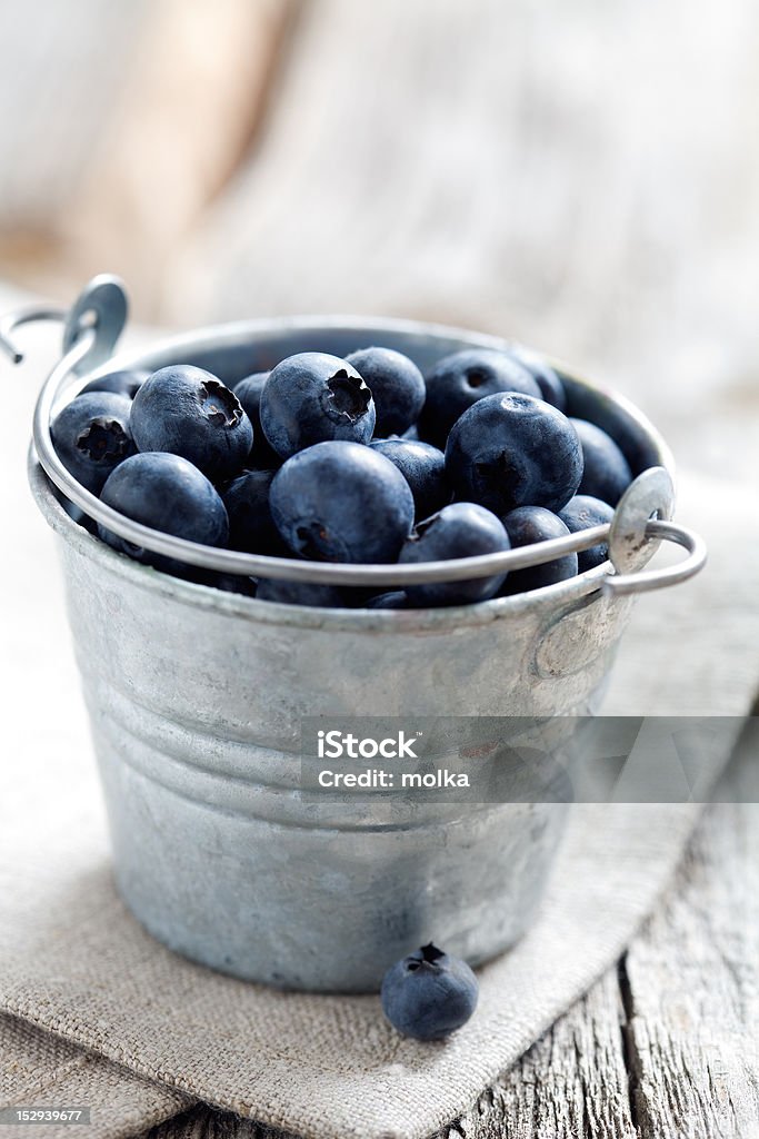 Blueberries Fresh blueberries in small bucket, selective focus Berry Fruit Stock Photo