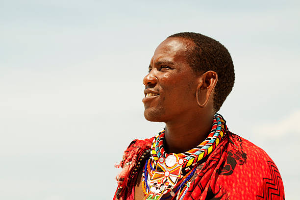 Portrait of young man as Massai warior Commercial portrait of young tribal Masai warrior man on hot bright sunny African beach kenyan culture stock pictures, royalty-free photos & images