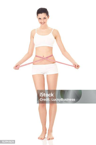 Fit woman measuring her waist. Weight loss concept. Royalty-Free Stock  Image - Storyblocks