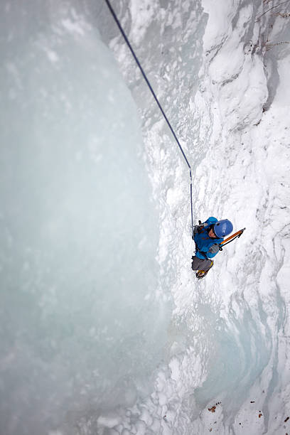 istock Female Ice Climber on a frozen waterfall 152941669