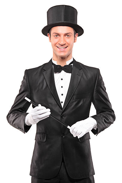 istock Magician holding a magic wand and posing 152941779