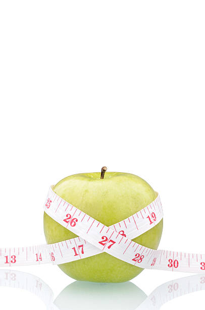 istock green apple with measure tape 152942624