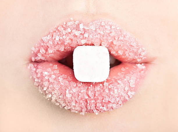 Lollipop in the mouth A lollipop in the mouth (close-up) candy in mouth stock pictures, royalty-free photos & images