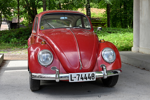 Oslo, Norway, July 6, 2023 - An old red Volkswagen Beetle (VW 1300) from 1966