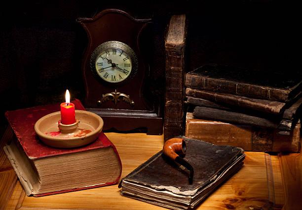 istock Still life with old  books, candle, clock and pipe 152943393