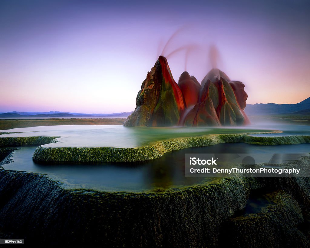 Fly Geyser Evening Fly Geyser, located in Nevada was photographed after sunset. Original shot on 4x5 film. Geyser Stock Photo