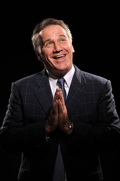 istock Happy handsome man praying wearing a suit 152945305