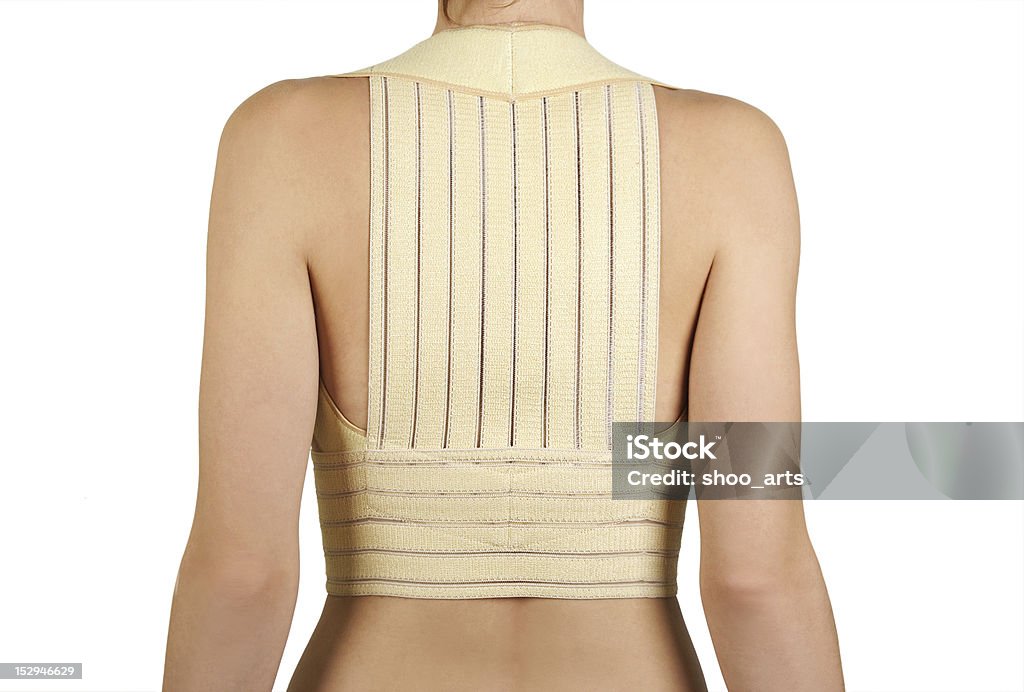 Donna in corsetto approccio risolutivo per la correzione - Foto stock royalty-free di Panciera