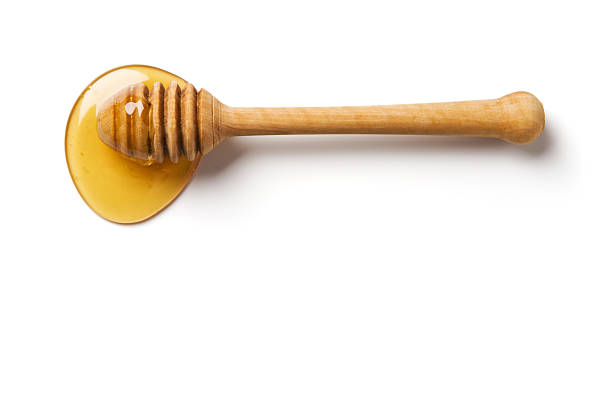 istock Wood honey dipper dipped into honey 152946720