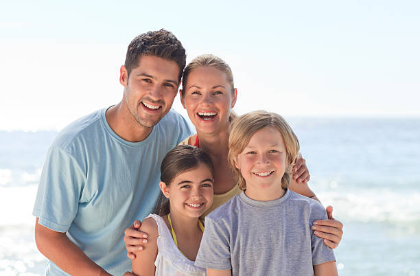 istock Joyful family at the beach 152947193