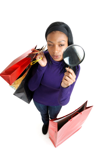 This is an image of a woman holding a shopping bag.