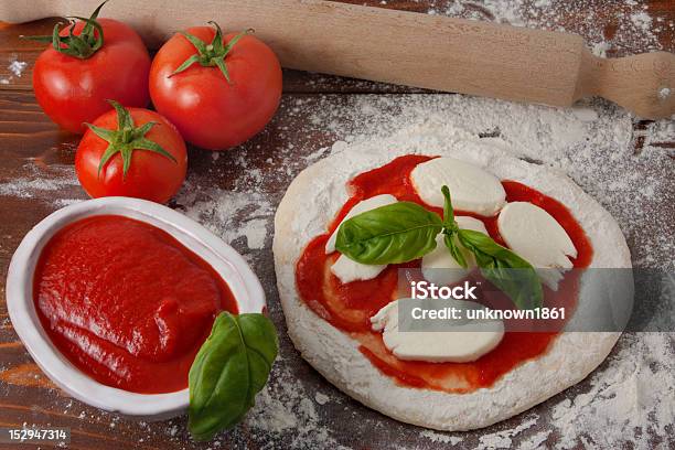 Pizza Preparation Stock Photo - Download Image Now - Basil, Cooking, Dinner