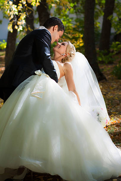 istock The groom holds bride leaning for support. 152947428