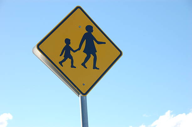istock Mom and kid road sign 152947836
